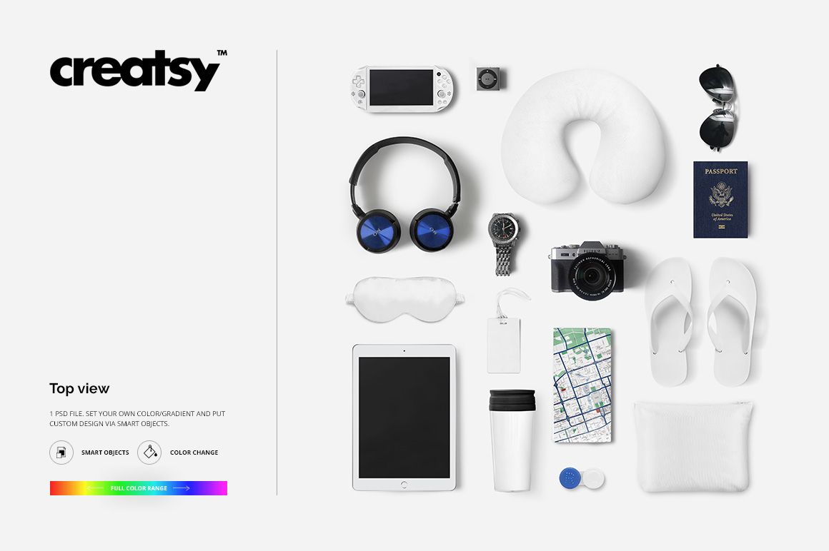 Top view of travel identity mockup featuring headphones, camera, neck pillow, passport, tablet, and travel essentials.