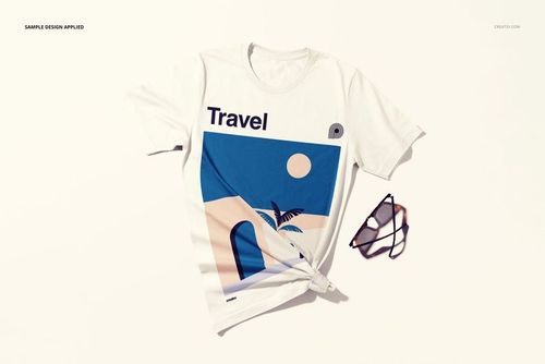 Front view of a white t-shirt mockup with a minimalist travel design, styled with a knot and sunglasses beside it.