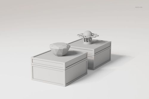 Two art deco jewelry boxes in light gray, shown from a front angle on a plain background, with geometric lids.
