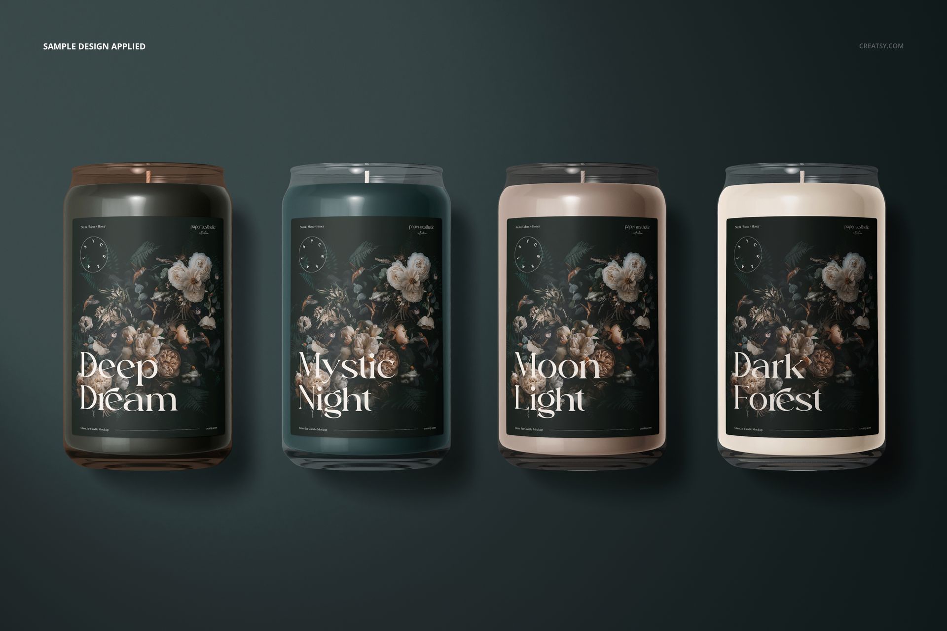 PSD mockup featuring four glass candles with illustrated botanical labels, shown from the front against a dark background.