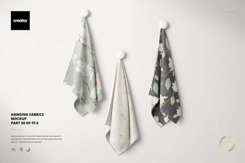 Hanging fabrics mockup with pastel and dark tones, floral motifs, and realistic folds against a light background.