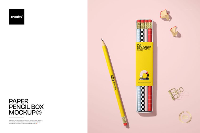 Paper pencil box mockup featuring a yellow rectangular box with pencils arranged inside, shown from a top view on a pink surface.