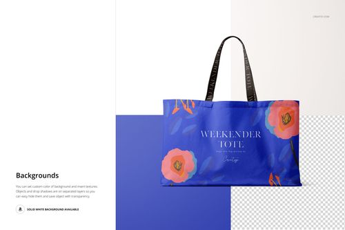 Large tote bag mockup with black handles, blue body, and orange floral accents shown in front view on a white background.