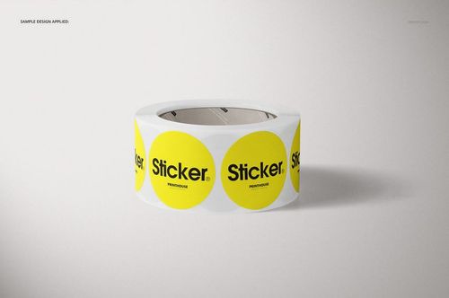 Front view of a round roll sticker mockup featuring yellow circle stickers with black lettering on a plain surface.