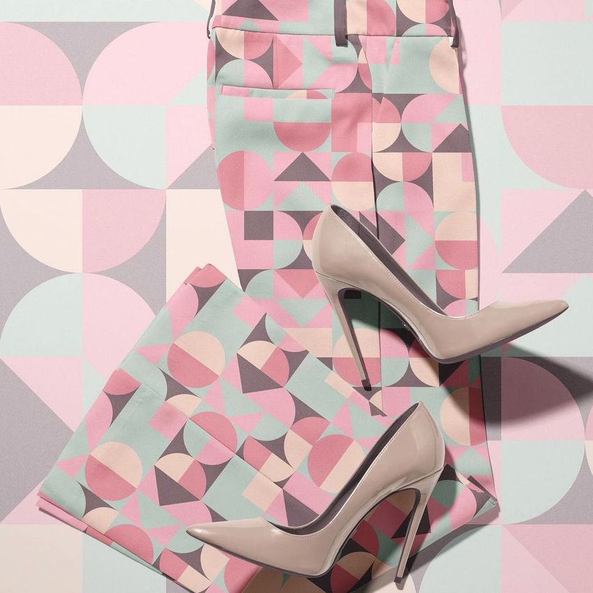 Blazer trousers two-piece set mockup with geometric pastel patterns in pink, mint, and beige, shown with beige high heels.