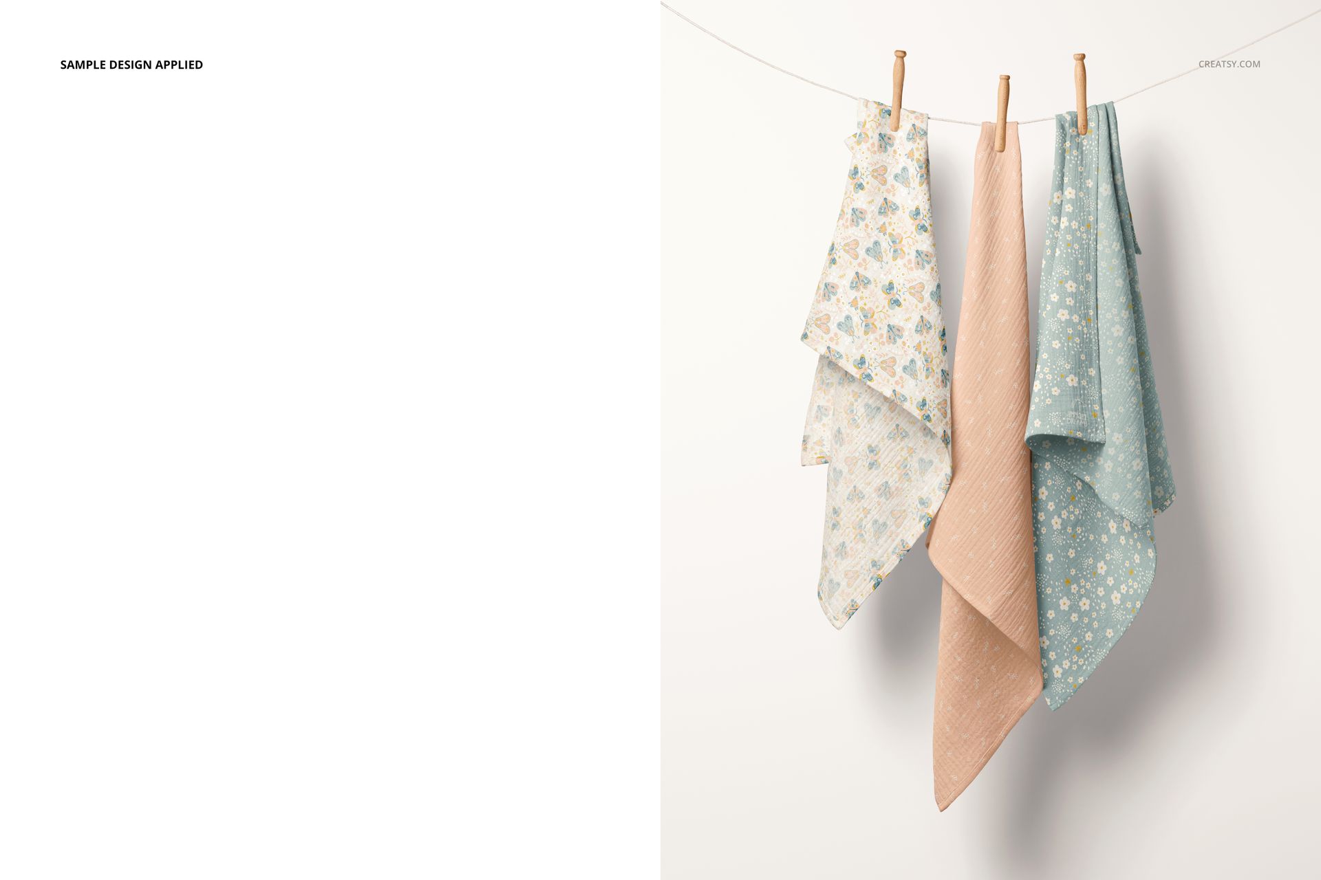 PSD mockup showing three muslin blankets in light blue and beige tones, hanging side by side on a white wall.