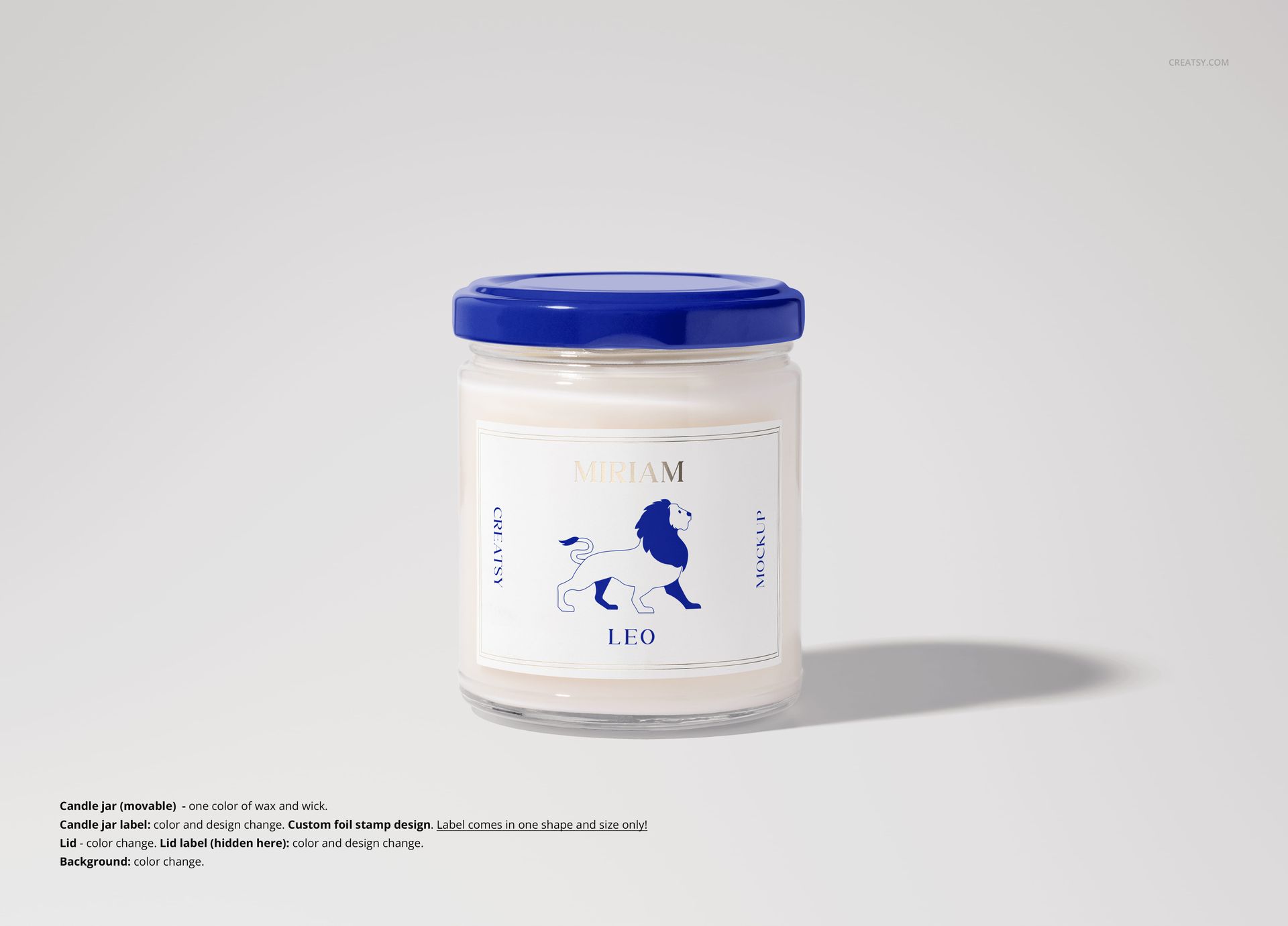 Single soy candle mockup in a transparent jar with blue lid, white wax, and custom label design on a light background.