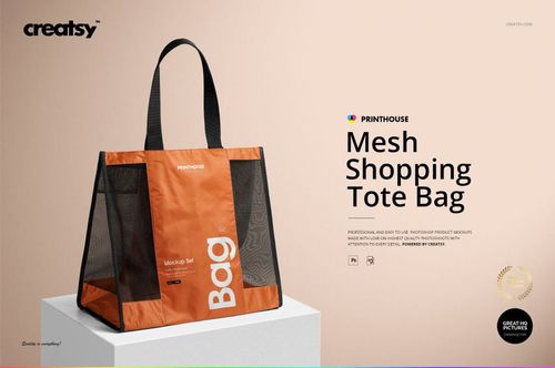 Front view of an orange and black mesh shopping tote bag mockup displayed on a light surface with shadow details.