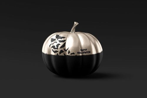 Front view of a Halloween pumpkin mockup with a metallic silver top and black bottom, decorated with flying bats and 'Happy Halloween' text.