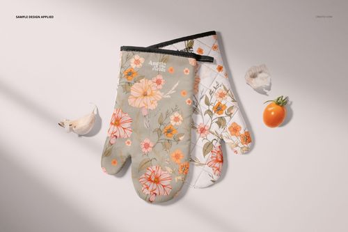 Oven mitt PSD mockup set with layered floral prints, presented on a neutral background with shells and vegetables.