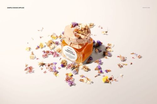 Flower honey jar mockup featuring a transparent square container, kraft lid, and floral accents, photographed from above.