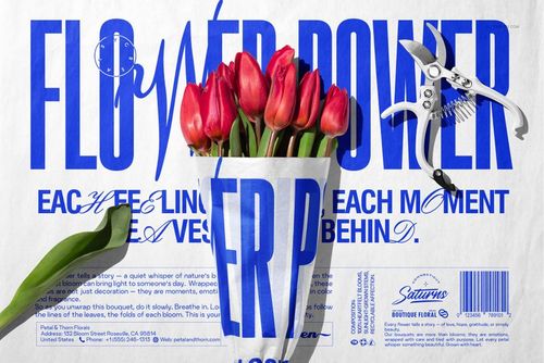 PSD mockup of a tulip bouquet in printed tissue paper with blue typography, surrounded by floral props and tools.