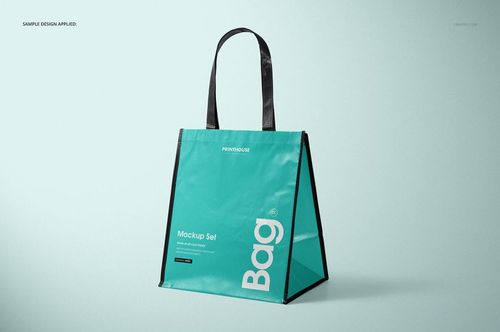 Laminated non-woven tote bag mockup shown in turquoise color with black straps, angled to display depth and structure.