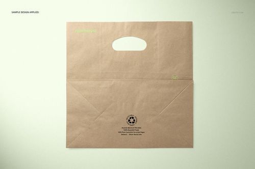 Die cut kraft paper bag mockup displayed from above, featuring a rectangular shape and a cutout handle.