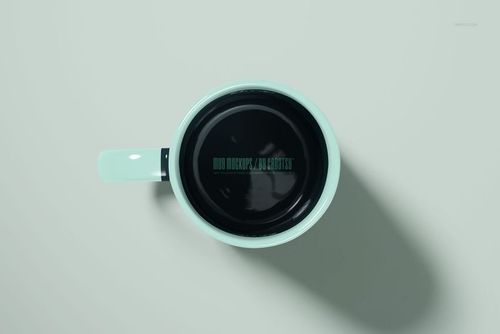 Top-down perspective of a 15oz mug mockup, featuring a pastel blue exterior and dark inner surface.
