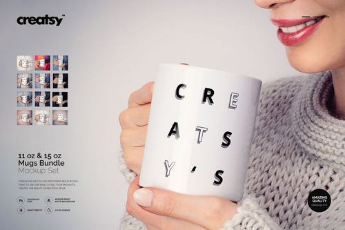 Front view of a woman holding a white mug with black and gray letters, wearing a light knit sweater, close-up scene.