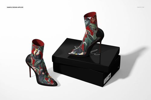 PSD mockup of ankle boots with multicolored botanical prints, set against a white background with a black shoebox.