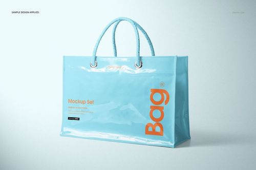 Glossy light blue vinyl PVC tote bag mockup with rounded handles and orange lettering, shown against a neutral backdrop.