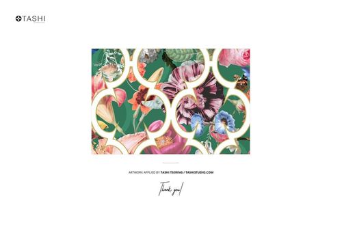 Cotton fabric mockup featuring a closeup of a colorful floral pattern with circular gold accents on a green background.