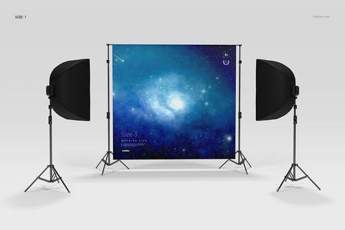 Custom printed backdrop mockup featuring a cosmic blue design, set up with two softbox lights in a studio environment.