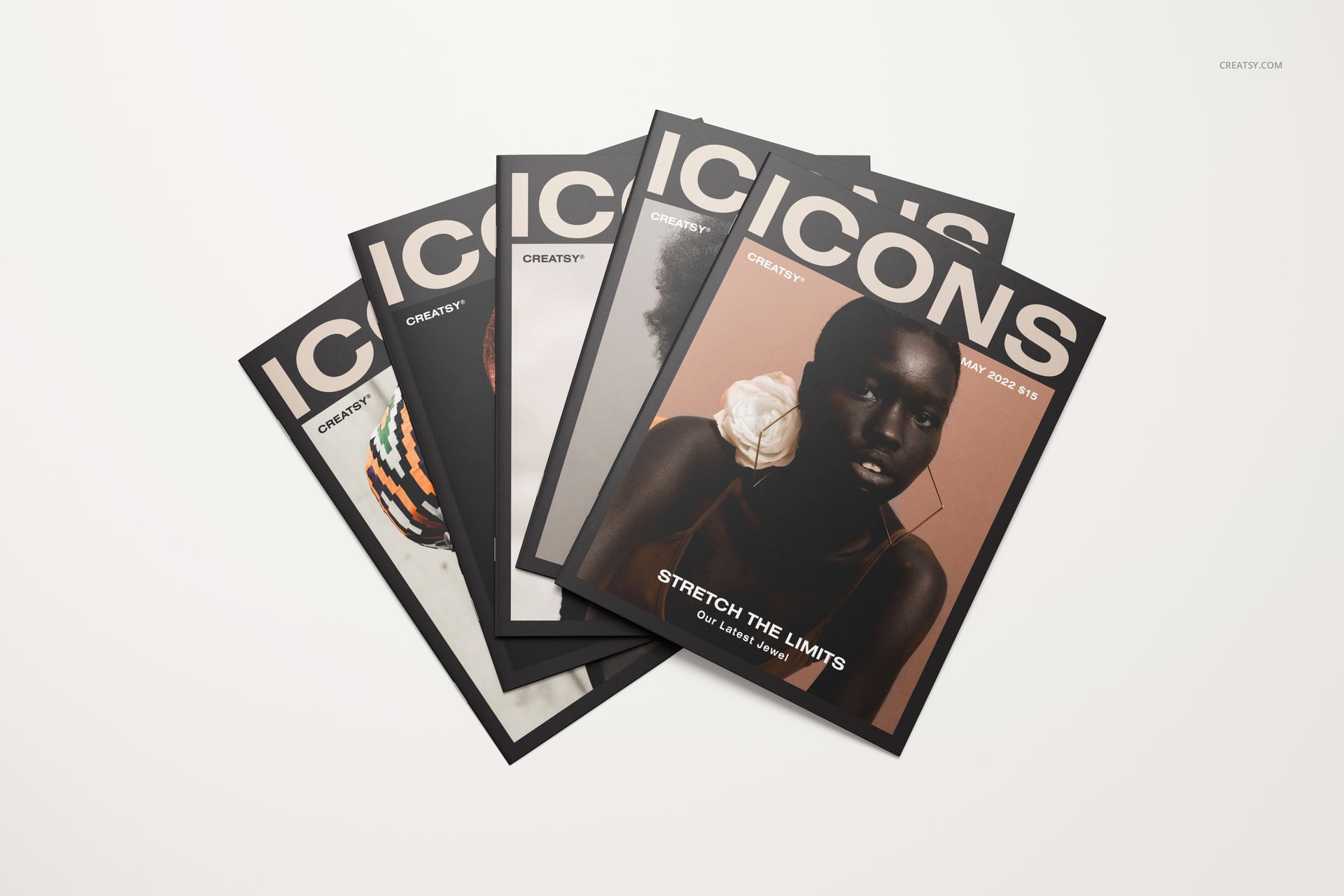 Group of five 8.5x11 magazine mockups with various cover images, spread out on a clean white tabletop.