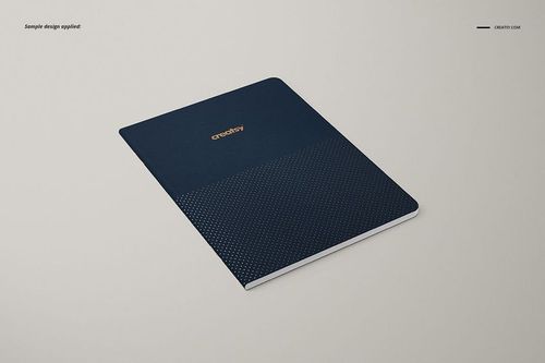 Front angled view of an A5 notebook mockup with a navy blue cover and subtle dotted design, placed on a beige background.