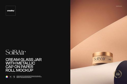 Cosmetic glass jar with gold metallic lid on a rolled paper surface, displayed in a PSD mockup with soft lighting.