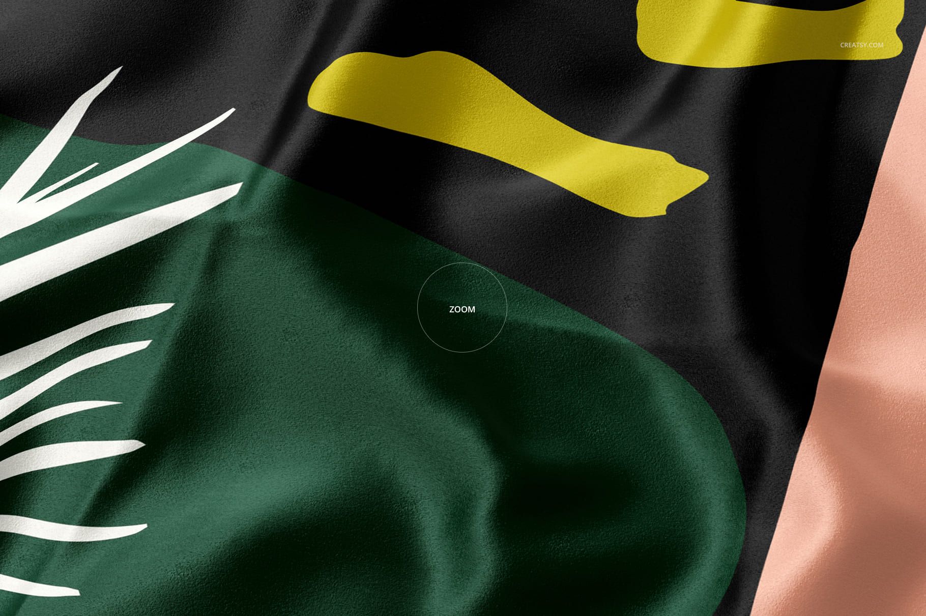 Detailed view of a silk textile mockup displaying smooth folds and a modern pattern in green, black, yellow, and peach.