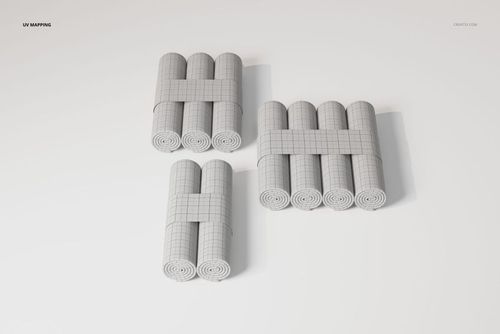 Three sets of changing pad paper rolls arranged in groups, featuring a grid pattern and viewed from above on a white surface.