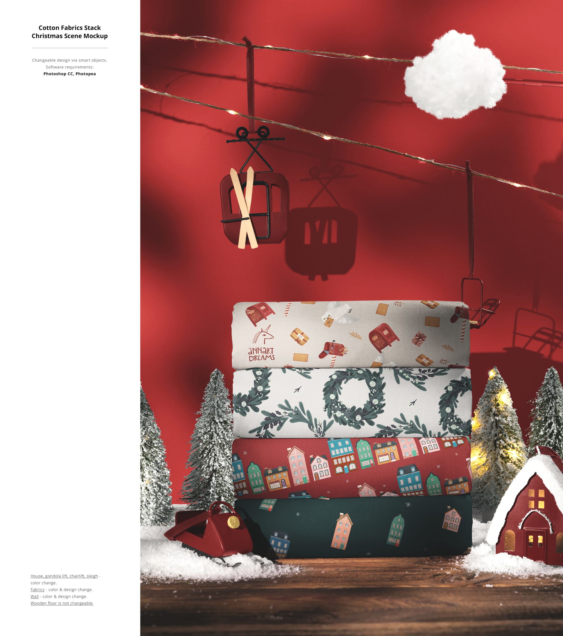 Christmas mockup scene showing a stack of patterned fabric with holiday motifs, surrounded by miniature trees and decorations.