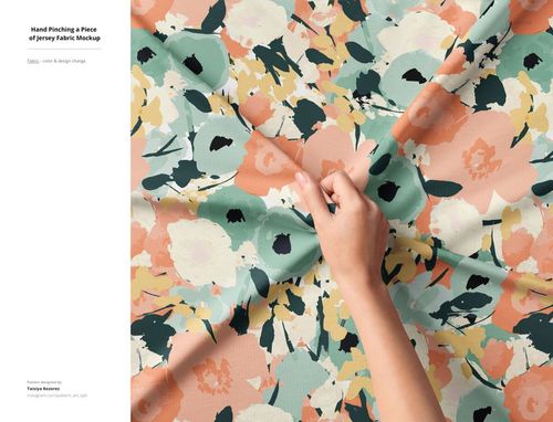 Jersey fabric mockup featuring a hand holding patterned cloth with abstract floral designs, viewed from above.
