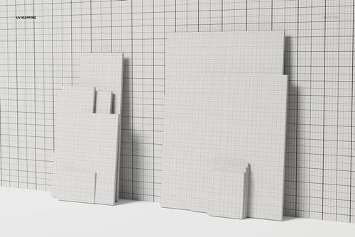 Front view of a canvas variety pack featuring multiple rectangular canvases with grid patterns against a grid wall.