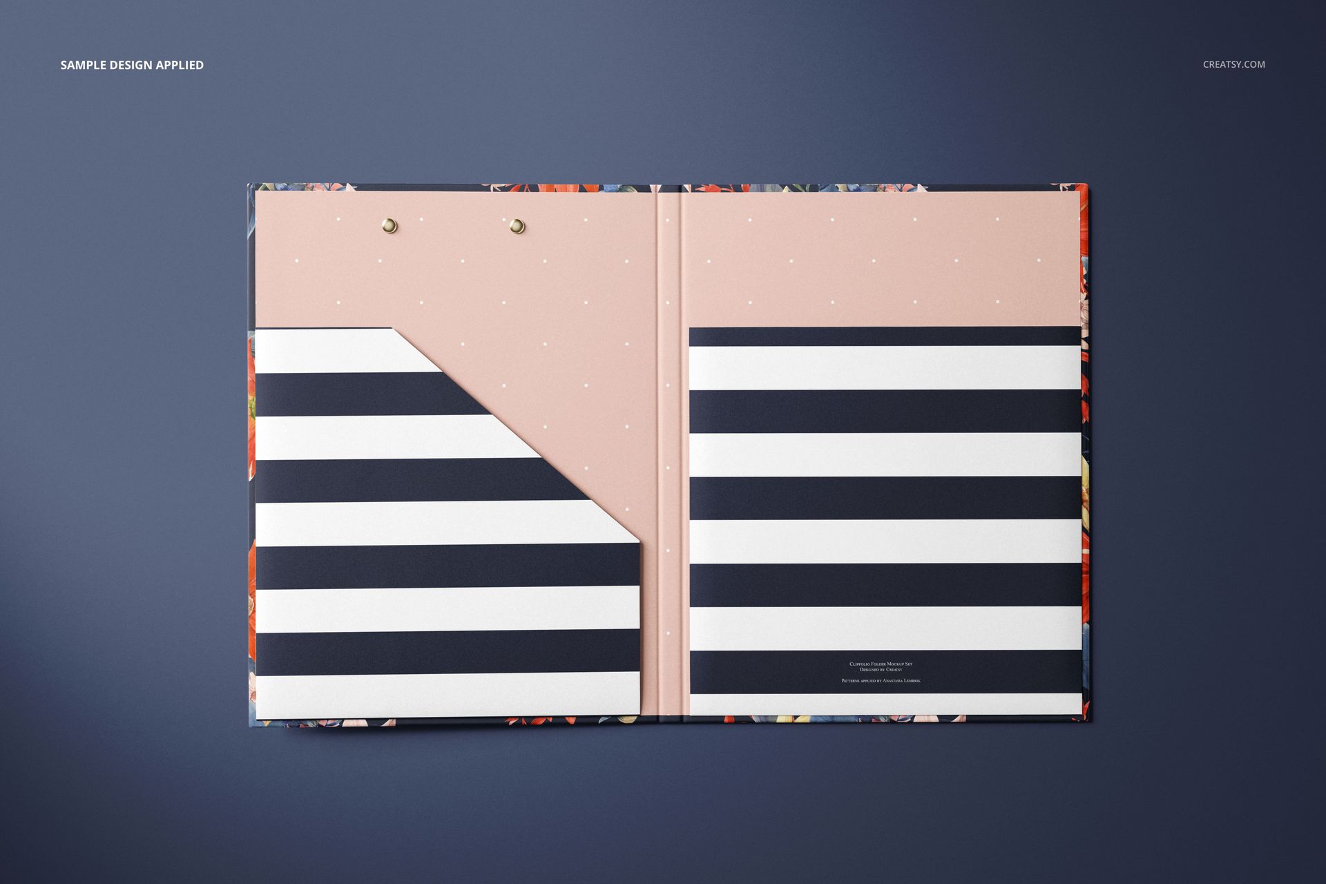 Open stationery folder mockup with pink and black striped design, shown from a top view on a dark background.