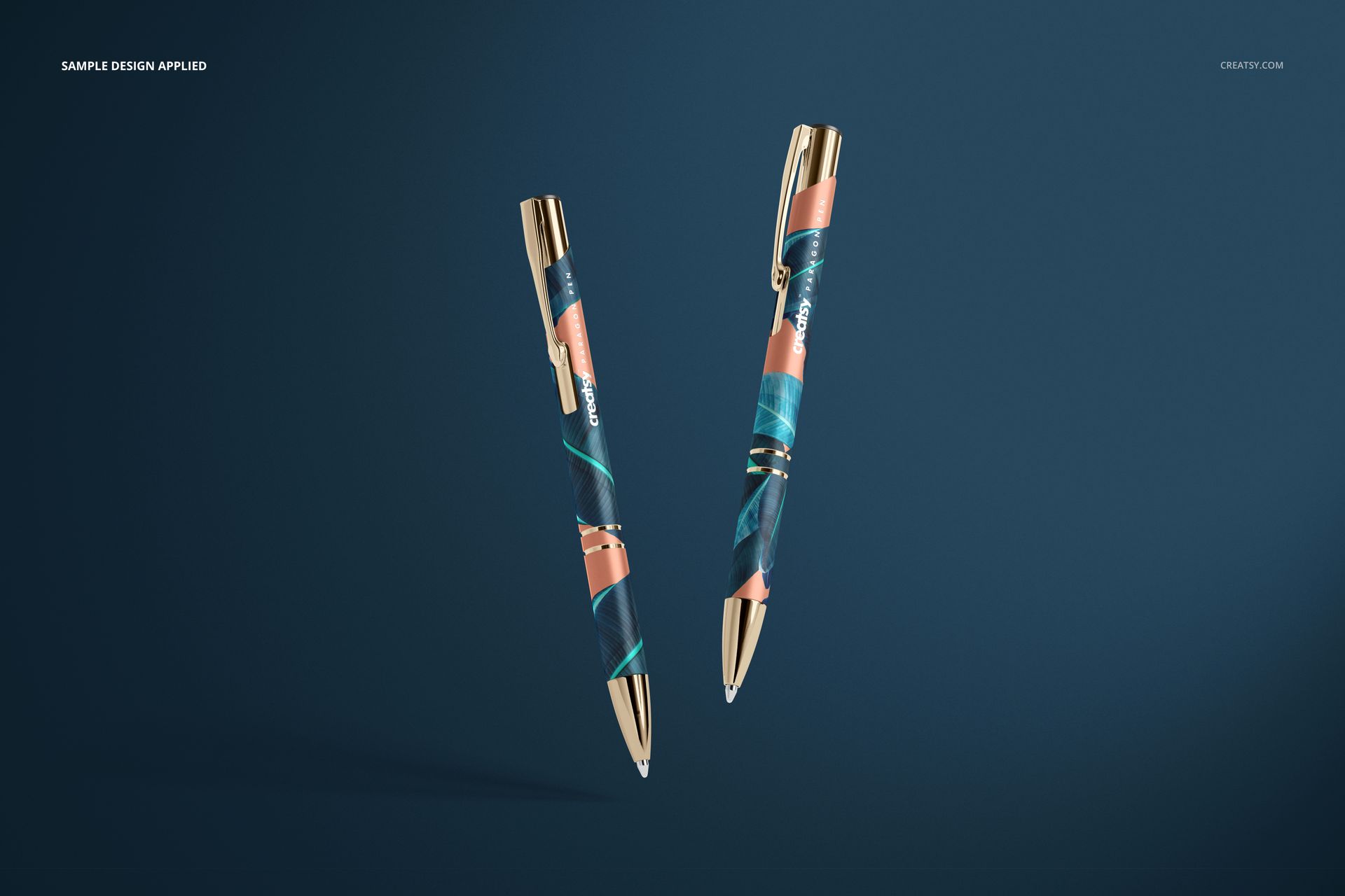 Floating pens with metallic gold details and vibrant swirling patterns, displayed in a realistic stationery mockup scene.