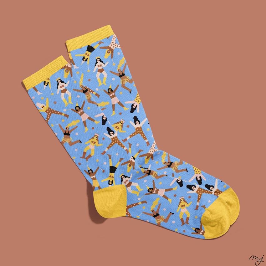 Socks mockup featuring a pair of blue socks with yellow cuffs, heels, and toes, decorated with colorful dancing figures.
