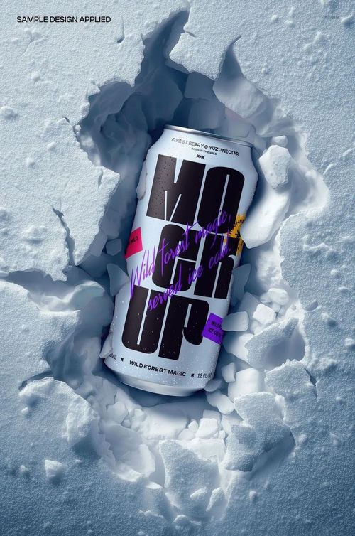 Tall beverage can with bold graphic design lying in a cracked snow surface, front view mockup scene.