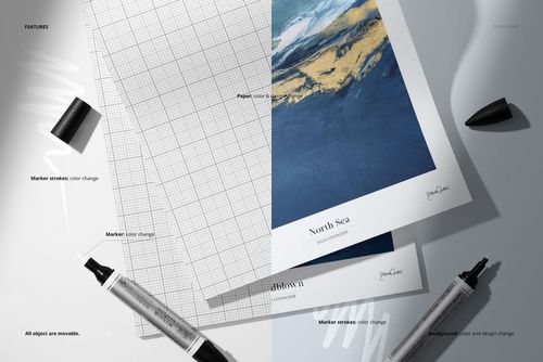 Top view of a linen canvas paper pad mockup with grid and artwork sheets, surrounded by black markers on a light surface.