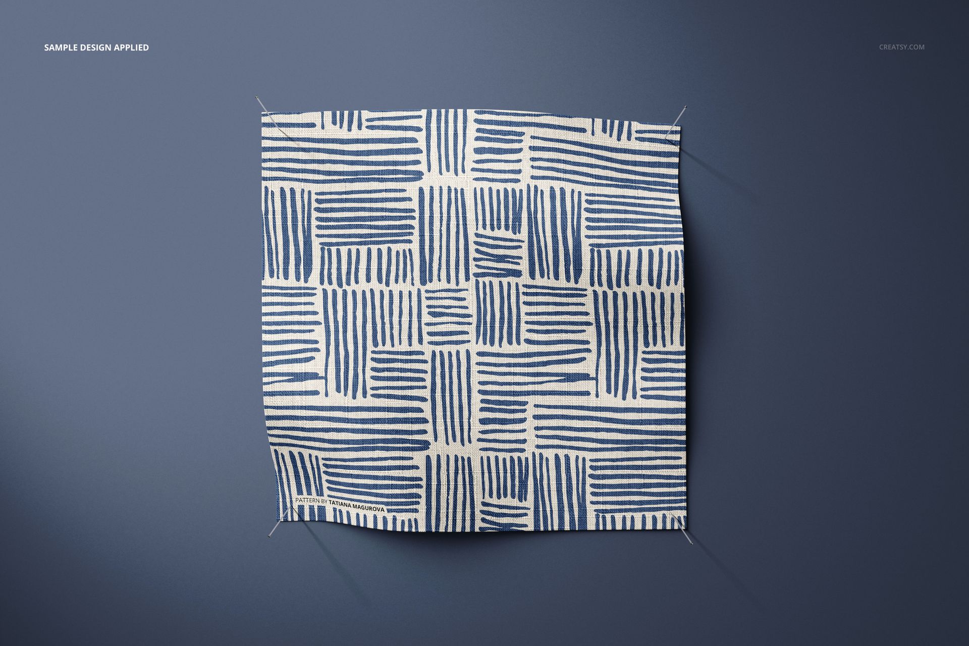 Fabric swatch mockup featuring a hand-drawn blue and white striped grid design, displayed flat against a blue surface.