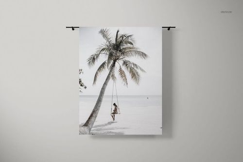 Front view of a tapestry mockup hanging on a wall, featuring a beach scene with a palm tree and swing.