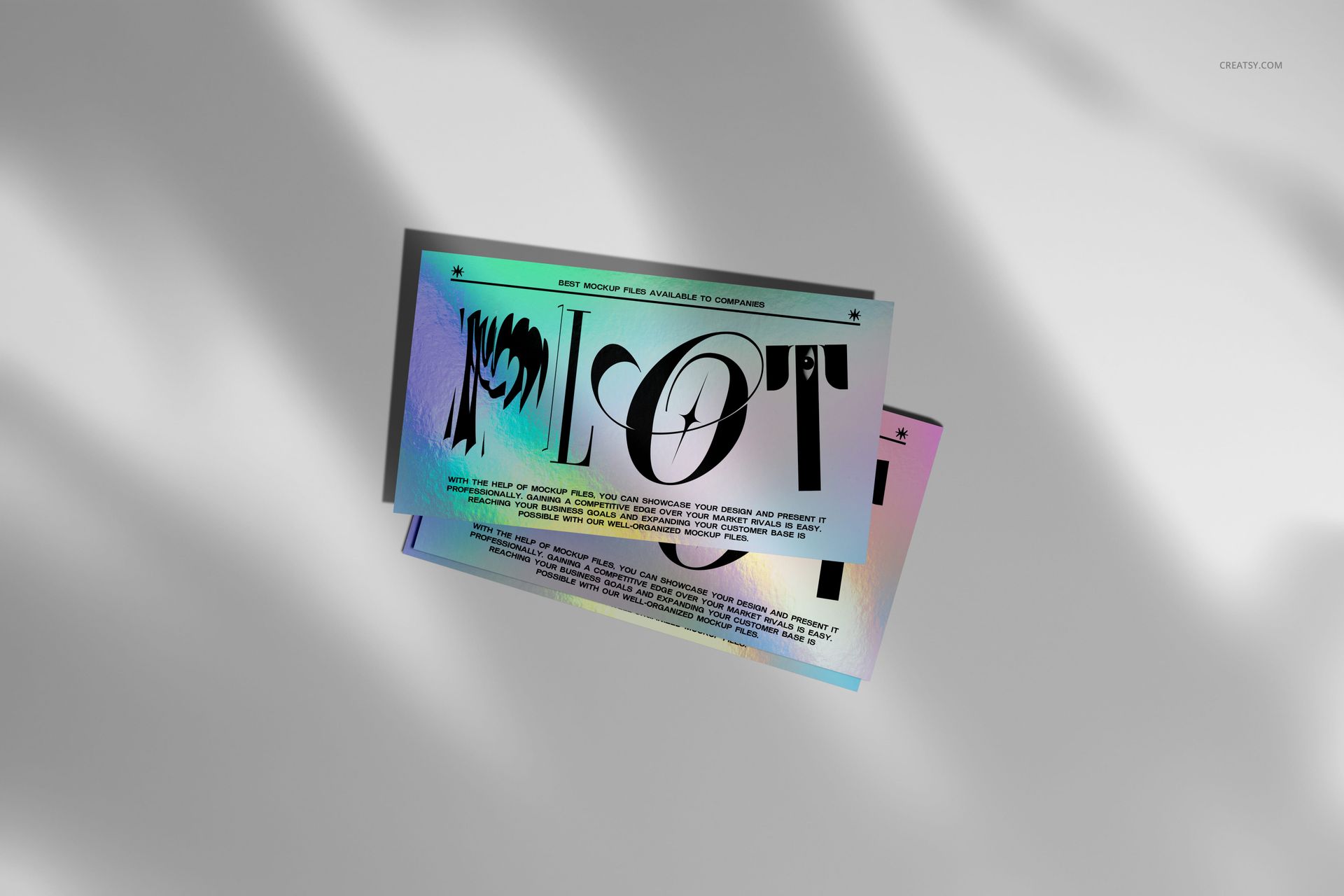 PSD mockup of holographic business cards featuring metallic shine and graphic text, arranged on a neutral background.