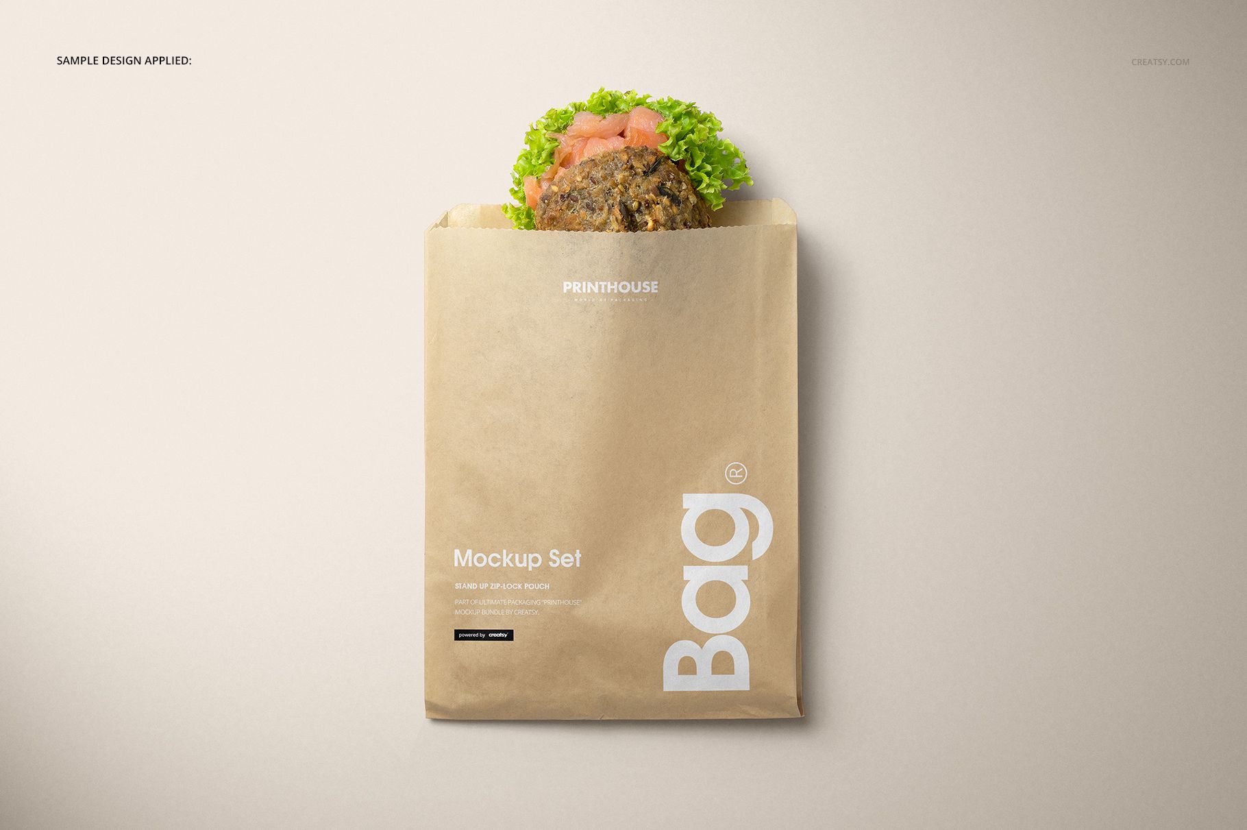 Kraft paper snack bag mockup with a sandwich sticking out, shown from above against a neutral background.