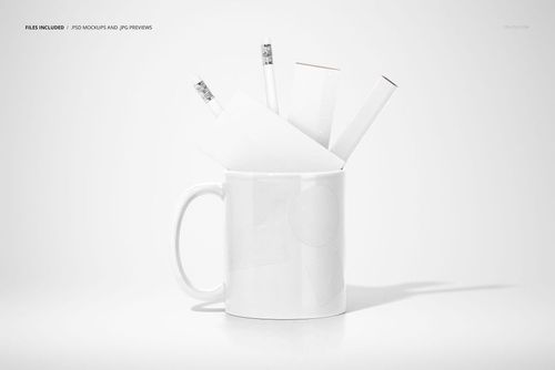 PSD mockup featuring a white mug with office supplies such as pencils and paper, set against a clean, white backdrop.