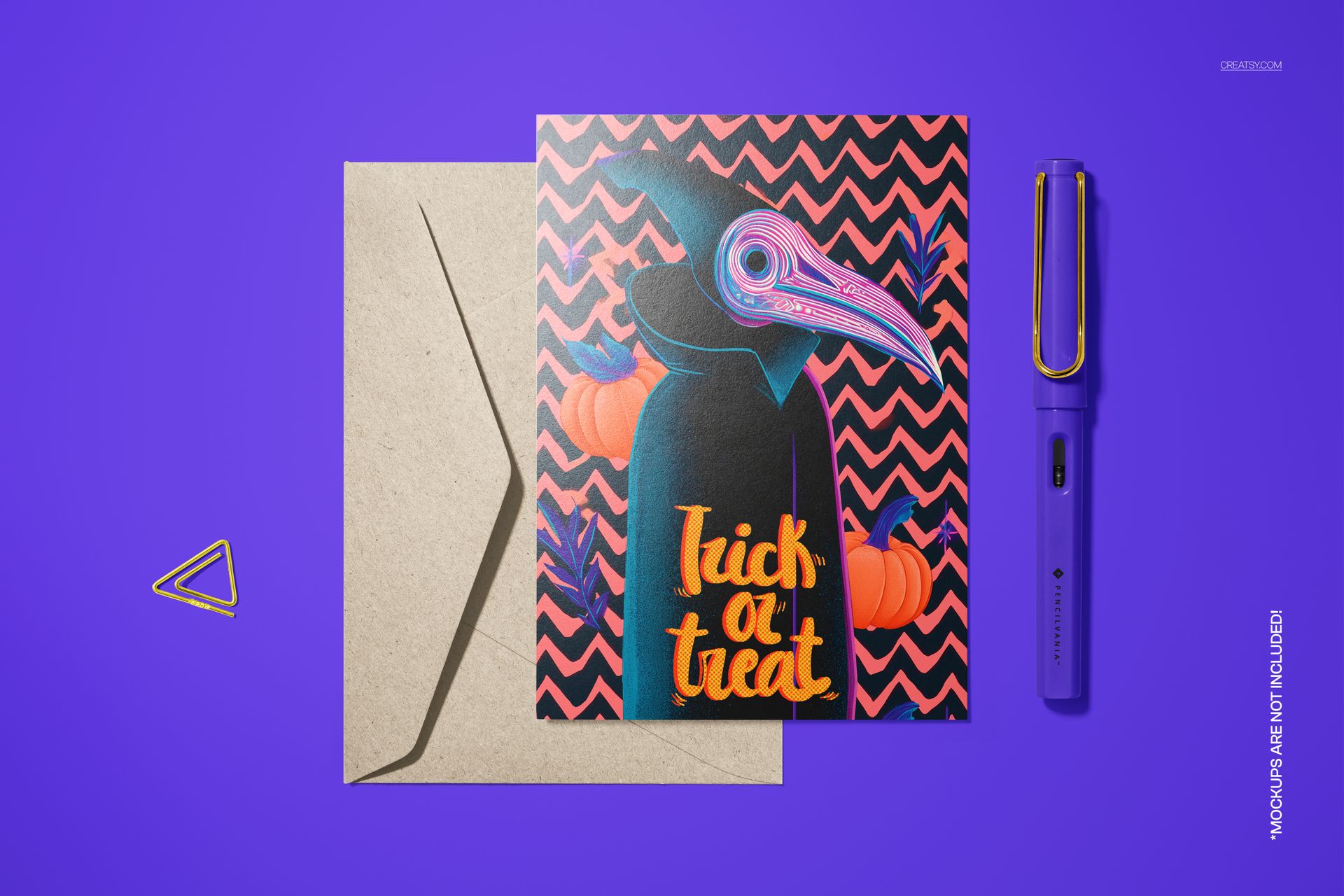 PSD mockup of a folded Halloween card with a masked figure illustration, pumpkins, and chevron background on purple.