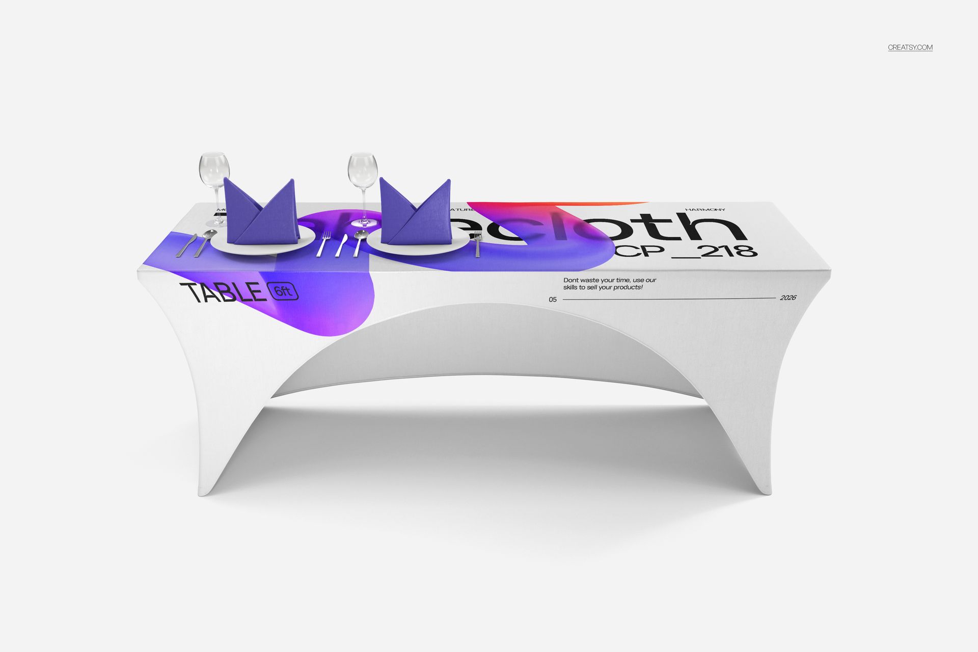 Front view of a custom stretched tablecloth mockup on a rectangular table with purple napkins and glassware.