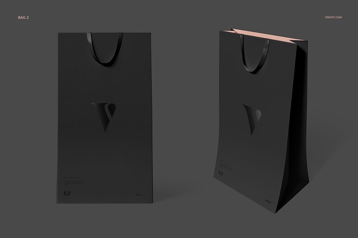 PSD mockup of black shopping bags with sleek matte finish, presented against a neutral gray backdrop.