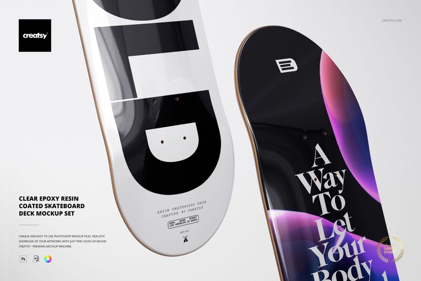 Skateboard deck mockup set showing two decks with glossy epoxy resin finish, one with abstract shapes and one with large text.