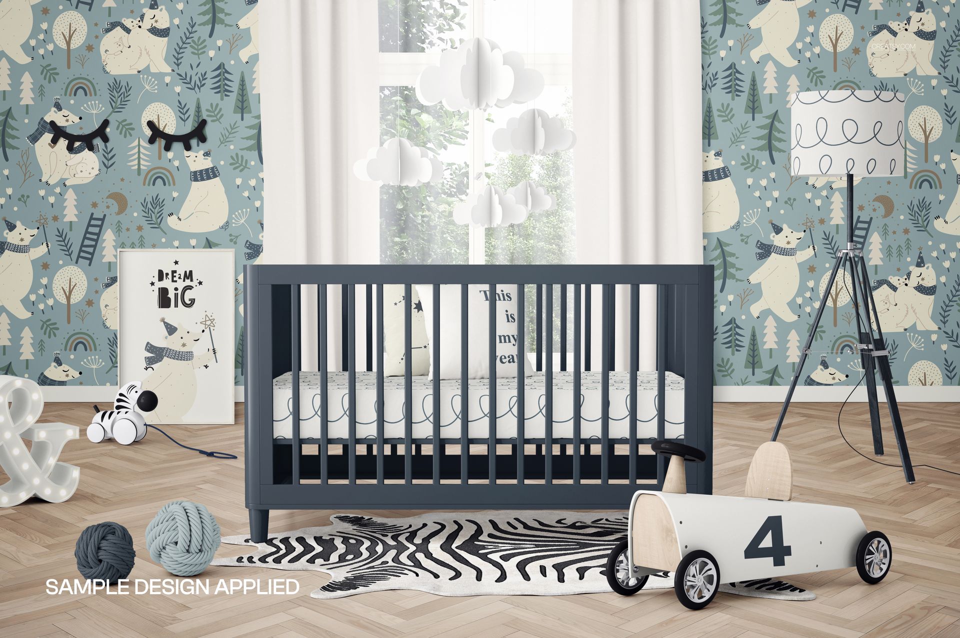 Nursery room mockup featuring a baby crib, patterned wallpaper, cloud mobile, and wooden toy car on a herringbone floor.
