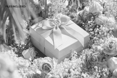 Elegant square gift box mockup surrounded by blooming red roses and greenery, top-down perspective.