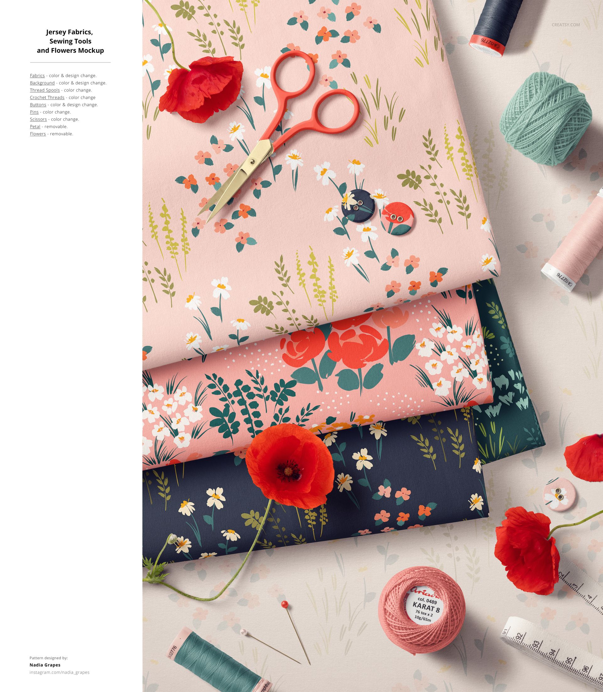 PSD mockup featuring layered floral jersey fabrics, poppy flowers, sewing tools, and accessories in a flat lay arrangement.