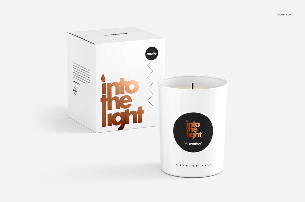 Scented candle mockup featuring a white glass jar with a black circular label, displayed next to a white box.